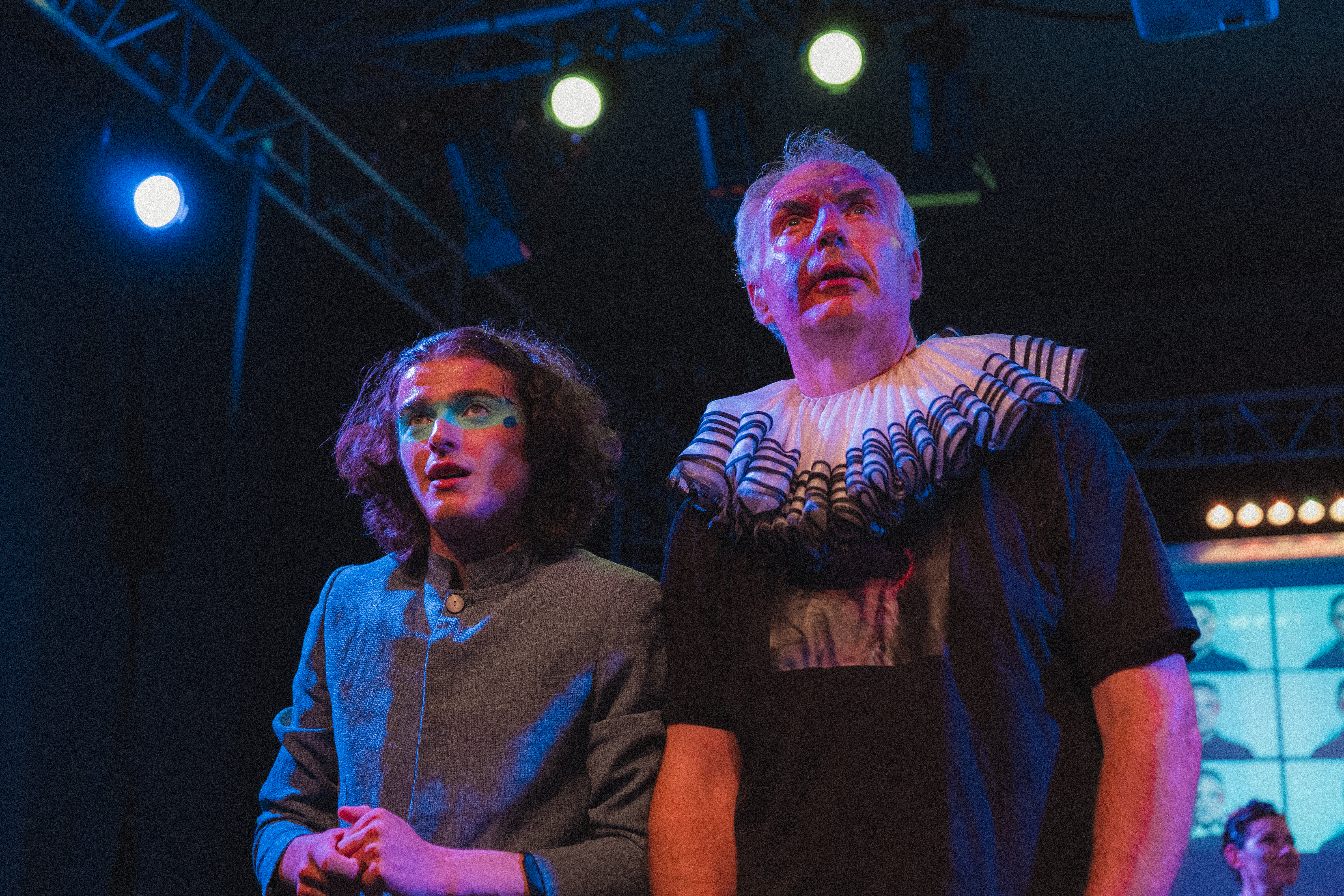 Lead performer during an immersive lighting cue from AI: Save Our Souls